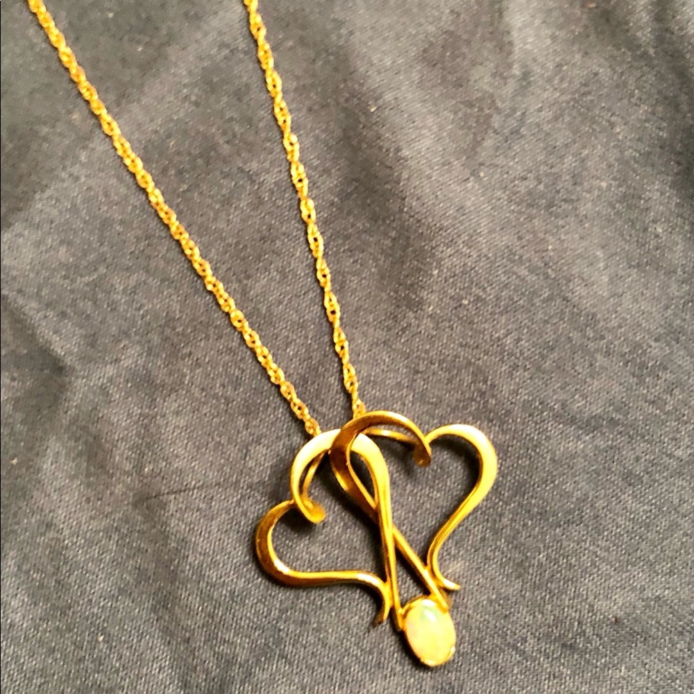 Double heart pendant with opal in 14k yellow gold